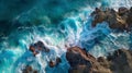 Aerial view of sea and rocks, ocean blue waves crashing on shore Royalty Free Stock Photo