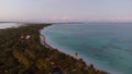 Aerial view of sea surrounded by beach with dense trees in Mexico Royalty Free Stock Photo