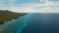 Seascape with tropical island, beach, resort, hotels. Bohol, Anda area, Philippines. Royalty Free Stock Photo