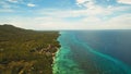 Seascape with tropical island, beach, resort, hotels. Bohol, Anda area, Philippines. Royalty Free Stock Photo