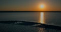 Aerial view sea water surface reflecting golden sunlight. Calm ocean surface Royalty Free Stock Photo