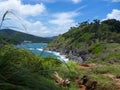 Aerial view of sea waves crashing on rocks cliff in the blue ocean. Top view of coastal rocks in Phuket ocean. Landscape view Royalty Free Stock Photo