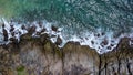 Aerial view of sea waves crashing on rocks cliff in the blue ocean. Top view of coastal rocks in Phuket ocean. Landscape view Royalty Free Stock Photo