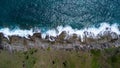 Aerial view of sea waves crashing on rocks cliff in the blue ocean. Top view of coastal rocks in Phuket ocean. Landscape view Royalty Free Stock Photo