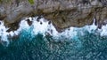 Aerial view of sea waves crashing on rocks cliff in the blue ocean. Top view of coastal rocks in Phuket ocean. Landscape view Royalty Free Stock Photo