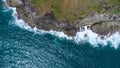 Aerial view of sea waves crashing on rocks cliff in the blue ocean. Top view of coastal rocks in Phuket ocean. Landscape view Royalty Free Stock Photo