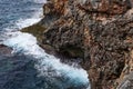 Aerial view of sea waves and fantastic Rocky coast, Danger sea wave crashing on rock coast with spray and foam before storm