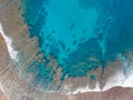 Aerial view of Sea waves reaching tropical beach landscape