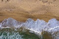 Aerial view of sea waves and a remote secluded sandy beach Royalty Free Stock Photo