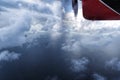 Seaplane flying through the clouds over Maldive island ocean Royalty Free Stock Photo