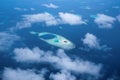 Aerial View from seaplane window over Atolls at Indian Ocean Maldives