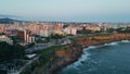 Aerial view seashore road at resort neighbourhood. Ocean waves splashing coast