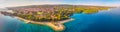 Aerial view of seaside promenade in Supetar town on Brac island with palm trees and turquoise clear ocean water, Supetar, Brac, Cr Royalty Free Stock Photo
