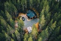 Aerial view of secluded cottage in the woods. Log cabin in the forest in rural Finland Royalty Free Stock Photo