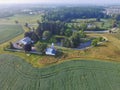 Aerial View of Serene Farmstead with Ponds in Rural Landscape