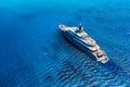 Aerial view of the ship from drone. Blue clear water in the Mediterranean Sea. Summer vacation and travel on a cruise liner.