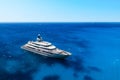 Aerial view of the ship from drone. Blue clear water in the Mediterranean Sea. Summer vacation and travel on a cruise liner.