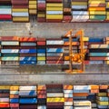 Aerial view of shipping container port terminal. Colourful pattern of containers in harbor. Maritime logistics global