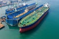 Aerial view of a shipyard repairing a large ship oil tank on the sea Thailand Royalty Free Stock Photo