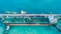 Aerial view shot of crude oil tanker ship anchored at the oil te Royalty Free Stock Photo