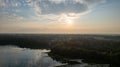 Aerial view shot by a drone of a beautiful dramatic and colorful sunset at coast of the lake. Nature landscape. Nature Royalty Free Stock Photo