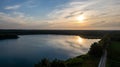 Aerial view shot by a drone of a beautiful dramatic and colorful sunset at coast of the lake. Nature landscape. Nature Royalty Free Stock Photo