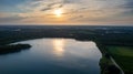 Aerial view shot by a drone of a beautiful dramatic and colorful sunset at coast of the lake. Nature landscape. Nature Royalty Free Stock Photo