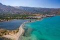 Aerial view showing the causeway connecting Elounda to Kolokitha island along with the remains of the Minoan city of Olous Royalty Free Stock Photo