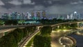 Aerial view Singapore city skyline with colorful fountain at Marina barrage garden night timelapse hyperlapse. Royalty Free Stock Photo