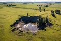 aerial view of a sinkhole in a grassy field
