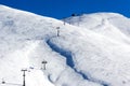 Aerial View of ski lifts over the snowed mountain