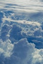 Aerial view through sky above the clouds abstract background.