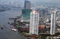 Aerial view of skyscrapers, skyline, or towers at The Chao Phraya River Bank in Bangkok city, Thailand, Asia. Royalty Free Stock Photo
