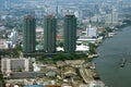 Aerial view of skyscrapers, skyline, or towers at The Chao Phraya River Bank in Bangkok city, Thailand, Asia. Royalty Free Stock Photo