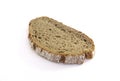 Aerial view of slice of artisan rye bread isolated on white background. Close-up of a piece of freshly baked artisan whole wheat Royalty Free Stock Photo