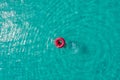 Aerial view of slim woman swimming on the swim ring donut in the transparent turquoise sea in Seychelles. Summer seascape with Royalty Free Stock Photo