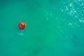 Aerial view of slim woman swimming on the swim ring  donut in the transparent turquoise sea. Summer seascape with girl, beautiful Royalty Free Stock Photo