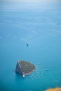 Aerial view of small Antalya Rat Island and diving boats in Mediterranean sea, Antalya, Turkey Royalty Free Stock Photo