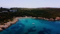 Aerial View of a Small Bay With Yatchs and Swimming People