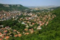 Aerial view of a small, beautiful green city with a lot of trees, situated in a deep karst gorge on a bright summer day. Town of P Royalty Free Stock Photo