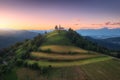 Aerial view of small church on the mountain peak at sunset Royalty Free Stock Photo