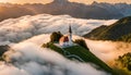 Aerial view of small church on the mountain peak at sunset in summer in Slovenia