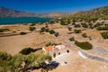 Aerial view of a small church next to a blue ocean on a hot Greek island Royalty Free Stock Photo