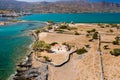 Aerial view of a small church next to a blue ocean on a hot Greek island Ascension Church, Elounda, Crete Royalty Free Stock Photo