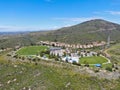 Aerial view of small community park in middle class neighborhood in the valley during sunny day Royalty Free Stock Photo