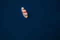 Aerial view of small fishing boat in the ocean Royalty Free Stock Photo