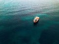 Aerial view of small fishing boat at sea, Greece Royalty Free Stock Photo