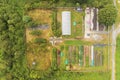 Aerial view, Small garden by a forest. Organic produce and vegetable, Green house and storage facility Royalty Free Stock Photo