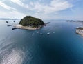 Aerial view of a small island covered with greenery in Japan on a sunny day Royalty Free Stock Photo