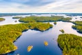 Aerial view of of small islands on a blue lake Saimaa. Landscape with drone. Blue lakes, islands and green forests from above on a Royalty Free Stock Photo